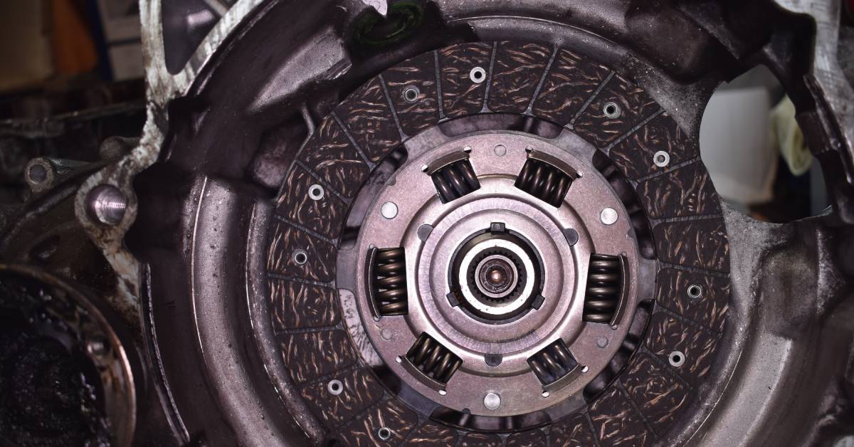 The clutch disc and components of a replacement clutch for a mini gearbox manual transmission vehicle.