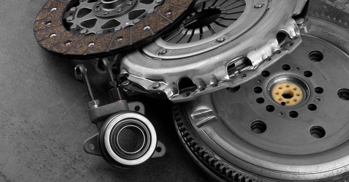 The flywheel and other components of a high-performance automotive racing clutch are stacked on top of one another.